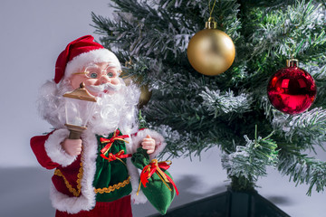 Toy Santa Claus near the Christmas tree