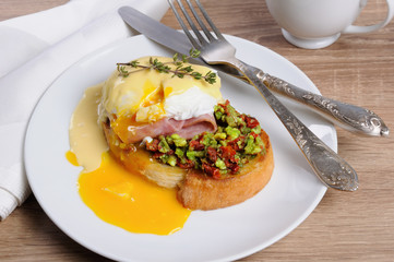 Toast with guacamole with egg Benedict