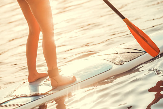 Woman standup paddleboarding