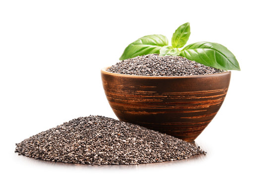 Bowl of chia seeds isolated on white