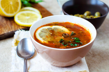 Solyanka Russian soup with olives and lemon.
