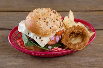 Hamburger and french fries in basket