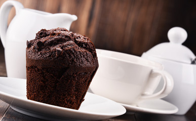 Composition with cup of coffee and muffin