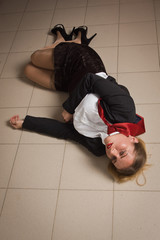 Crime scene with strangled business woman in office