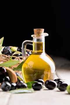 Olives And Olive Oil In a Bottle