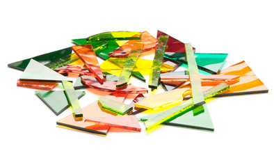Colorful pile of stained glass shards on a white background. Glass recycling concept