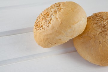 Two buns on wooden table