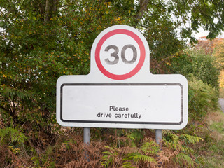 village rectangle sign with 30 miles per hour speed limit