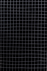 metal grid on a black background