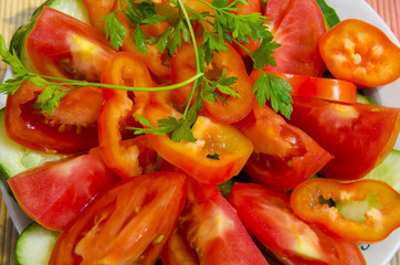 Slicing vegetables in large pieces on a plate.
