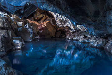 Inside surreal Grjotagja lava cave, near Myvatn, North Iceland