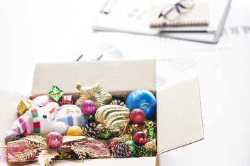 Christmas Decoration. Holiday Decoration in Box on Desk Businesman.