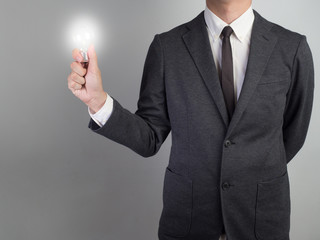 Businessman confirm project .Idea business on white background.he  hold light bulb  for some idea invest money for business.