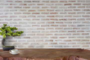 Mock up wooden table with white brick wall. For product display montage..