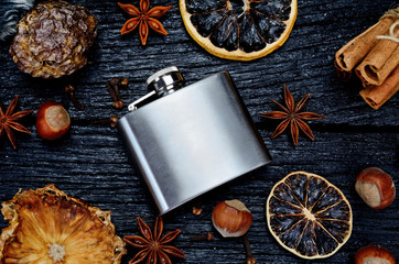 metallic bottle for alcohol on table