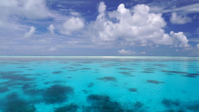 aerial shot of a tropical lagoon of an atoll in French Polynesia
