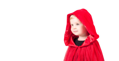 Little Red Riding Hood. Beautiful little girl in a red raincoat. Halloween