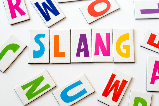 Slay, teen slang meaning someone looks amazing or did something very well.  Word in wooden alphabet letters isolated on colorful background Stock Photo  - Alamy