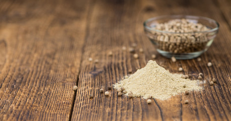 White Pepper on vintage wooden background