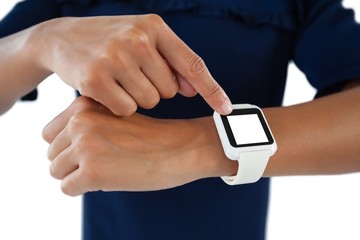 Female executive operating her smartwatch