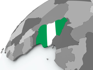 Fototapeta premium Flag of Nigeria on grey globe