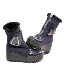 Female winter boots on high soles on a white background