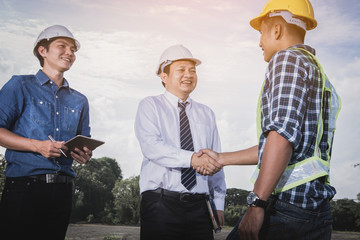 engineer and construction team working on checking progress of construction site;engineer  working on checking progress of construction site