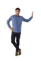Portrait of young businessman standing with hand on hip