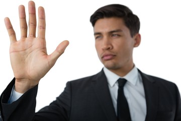 Close up of young businessman touching invisible interface