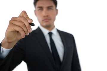 Businessman writing on invisible interface