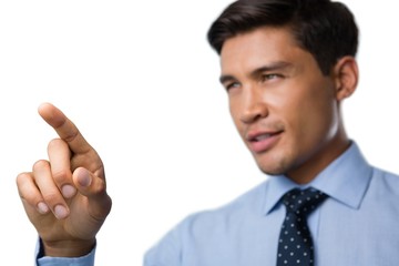 Confident young businessman using invisible interface