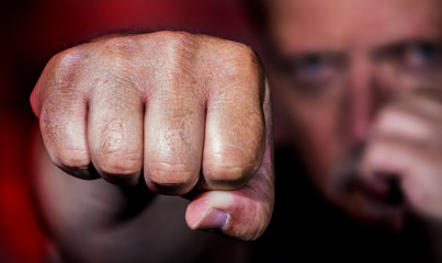 a man beats brutally with his fist