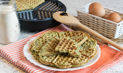 Home made waffles with spinach, heart shaped. Delicious breakfast