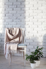 Obraz na płótnie Canvas Modern chair in white room interior parquet wood floor.