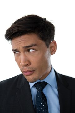 Close up of young businessman looking away