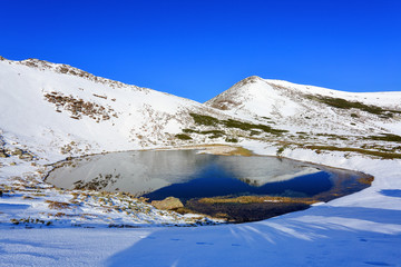 The fantastic view of the mountains and lawns covered with snow is opened from the coast.