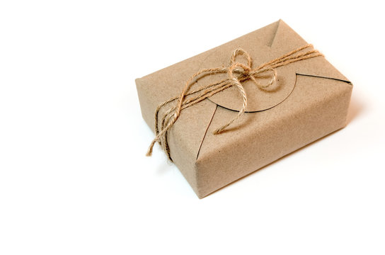 Gift box wrapped in kraft paper and rustic hemp as natural rustic style