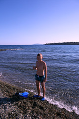 Teenager on the sea coast.