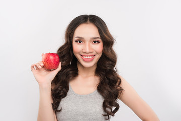 Happy sports woman showing red apple. Healthy fruit concept.