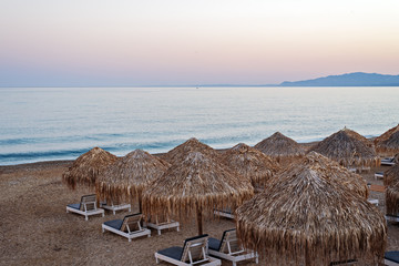 Umbrellas and beds, beaches of Greece