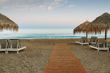Umbrellas and beds, beaches of Greece