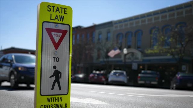 Close up of a state law crosswalk sign in small american town