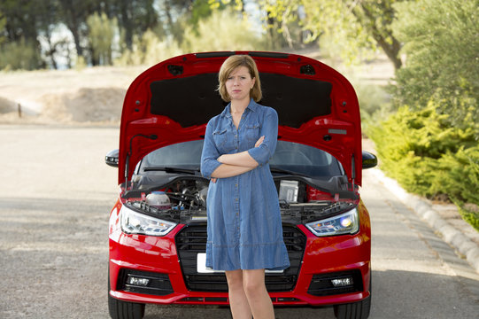 Desperate And Confused Woman Stranded On Roadside With Broken Car Engine Failure Or Crash Accident