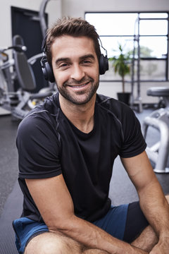 Smiling athlete wearing headphones, portrait