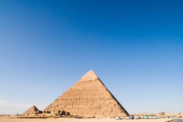 Fototapeta na wymiar Tourist buses at the Khafre Pyramid in Giza