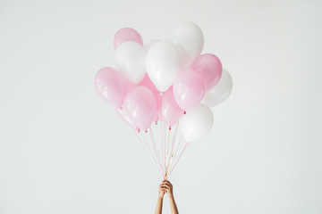 bunch of pink and white balloons