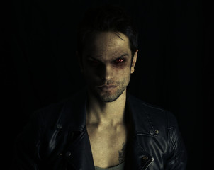 dark vampire posing  - obrazy, fototapety, plakaty