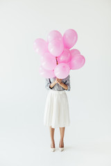 woman holding balloons