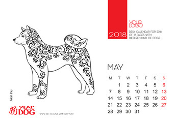 The desktop calendar page for 2018 with the image of a dog, a symbol of the Chinese horoscope for 2018.