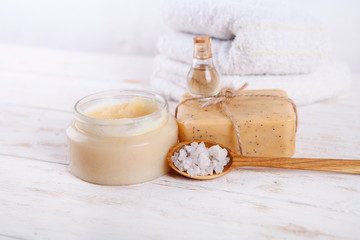 Obraz na płótnie Canvas Scrubbody natural handmade soap bar and sea salt on wooden background